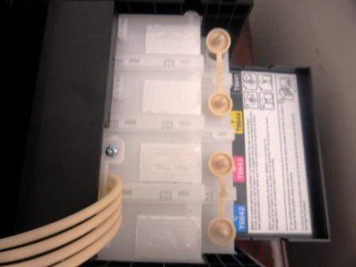 The 4 ink tanks on the side of the printer hold the equivalent of 20 cartridges of ink.