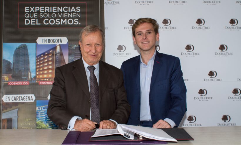Richard Cajiao, Cosmos Group, and Juan Corvinos, Hilton Worldwide, sign agreement to open two DoubleTree by Hilton hotels in Bogota, Colombia. (Photo: Business Wire)