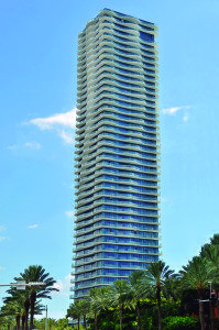 "We can make glass that protects from the weather, while letting you have a great view. People like that you can now be in harmony with the surroundings." - José M. Daes. Above: Suburban Miami's beachfront Regalia condo tower, featuring Tecnoglass materials.