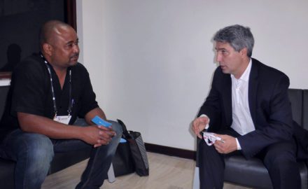 Marcelo González (right), CEO VeriTran, speaks with Loren Moss (left) of FInance Colombia. (Photo credit: Loren Moss)