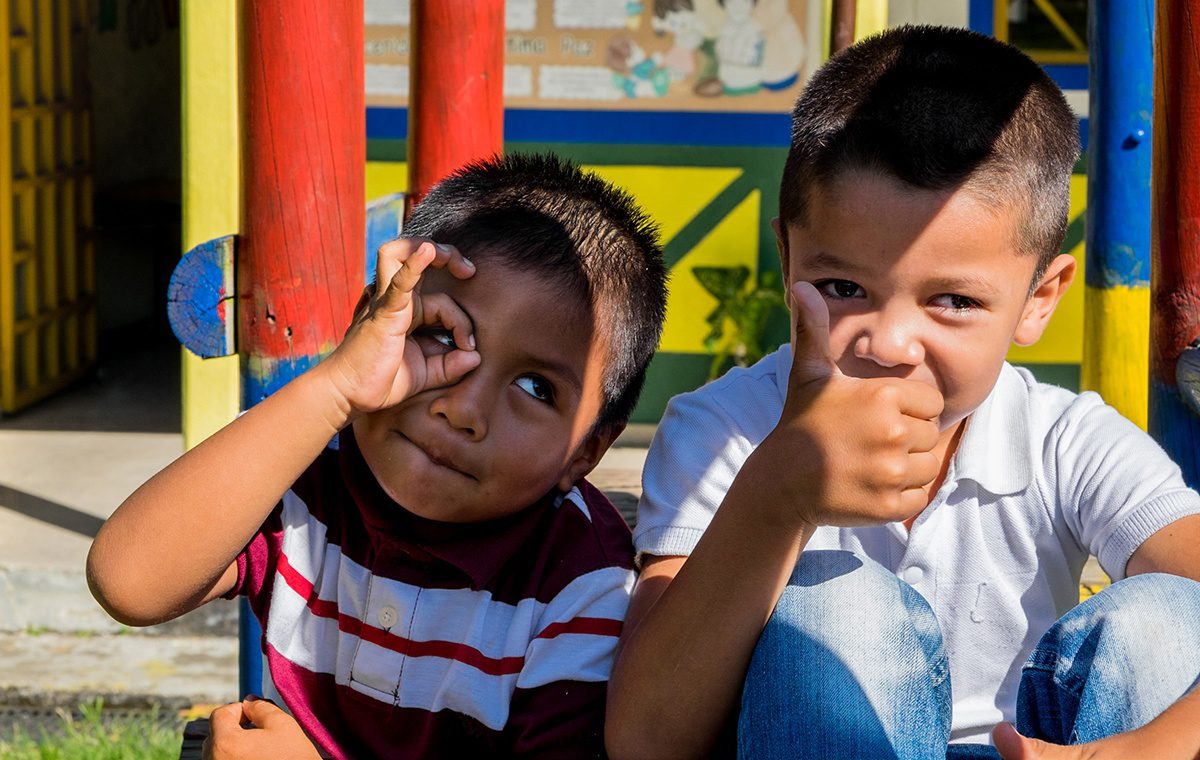 Two young students enjoy some recess time during their school day at Sede Barragán, a rural school of about 80 kids in Quindio. (Credit: Jared Wade)