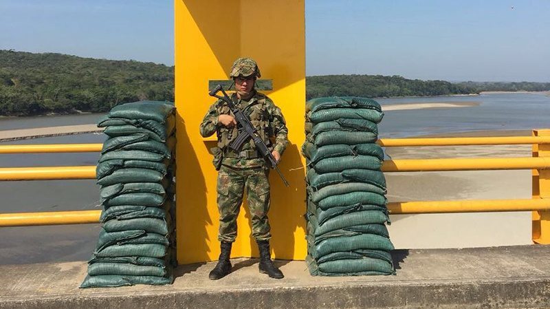 A solider safeguards a bridge in Colombia this weekend as the Army ramped up security efforts. (Credit: Ejército Nacional de Colombia)
