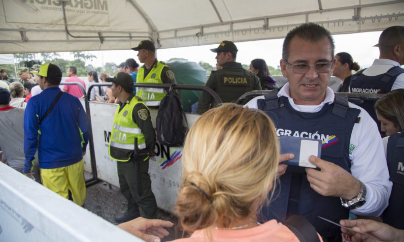 Migration officials work at the Colombian/Venezuelan border city of Cúcuta, where tens of thousands of Venezuelans cross every day due to the desperate social conditions and economic crisis occurring in their homeland. (Credit: National Police of Colombia)
