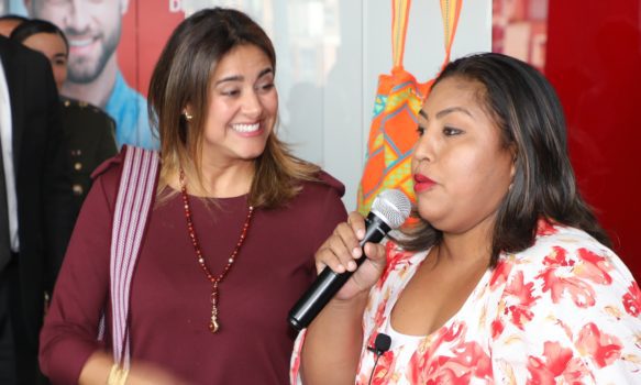First Lady of Colombia Maria Juliana Ruíz de Duque talks with Wayúu leader Monica Patricia Barros López in the regional headquarters of Chevron Texaco in Bogotá during the opening event of the new food bank in La Guajira.