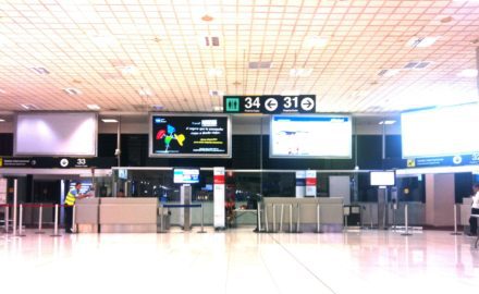 Empty airport with idle workers and no passengers. Photo © 2017 Loren Moss