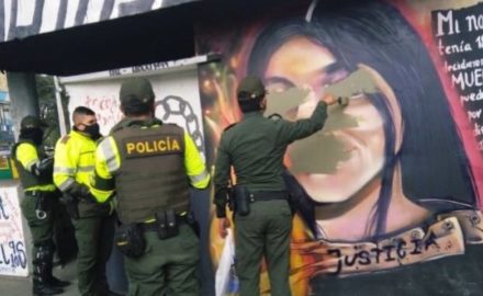 Colombian police paint over a mural of Julieth Ramirez, who was killed by a police gunfire while protesting the death of Javiér Ordoñez.