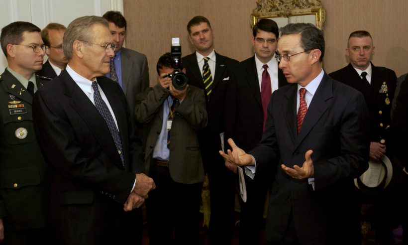 Secretary of Defense Donald H. Rumsfeld (left) listens as President Álvaro Uribe (right) speaks to a group assembled at the Colombian presidential residence on August 19, 2003. (Photo by TSGT Andy Dunaway, U.S. Air Force)