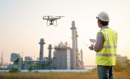 Drone inspection. Operator inspecting construction building turbine power plant