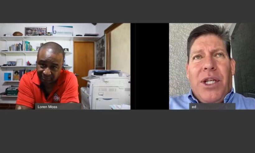 Ed Delgado of Ecuatoreana (right) speaks with Finance Colombia's Executive Editor Loren Moss