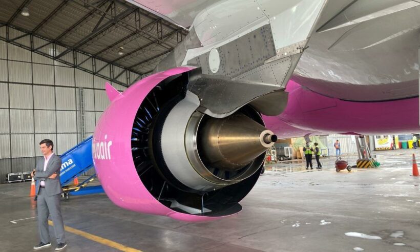 ABOVE PHOTO: Viva CEO Félix Antelo stands in front of a GE LEAP 1A high-bypass turbofan mounted on one of the airiline's brand new Airbus A320neo aircraft painted in its breast cancer awareness livery. (Photo ©Loren Moss)