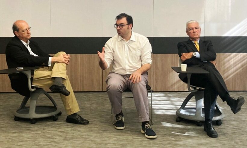 Sergio Guzmán (center) answers questions accompanied by Sergio Escobar of Medellín Global (left) and Luis Guillermo Suárez of the Medellín Chamber of Commerce. (Photo © Loren Moss)