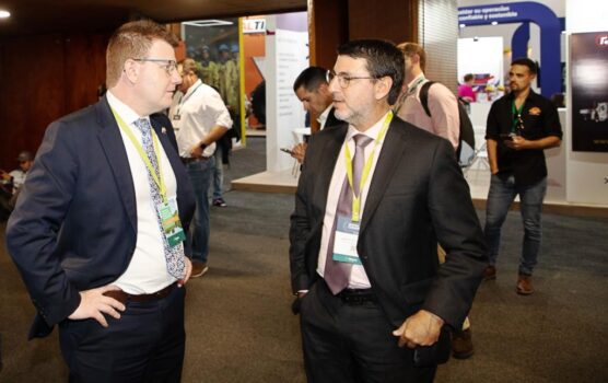 Ambassador Unkles speaks with a guest at Colombia's MinExpo mining industry event, where Australia's trade promotion agency was a sponsor.