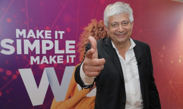 Hitendra Patel poses for a photo at BPrO's CX Summit in Cartagena, Colombia.