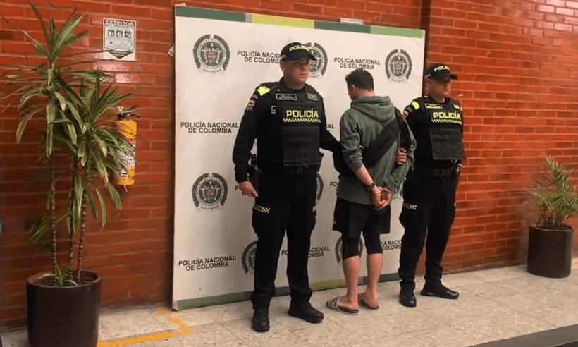 Canadian citizen Vince-Tong Sozio takes a photo in handcuffs after being detained for assaulting a police officer.