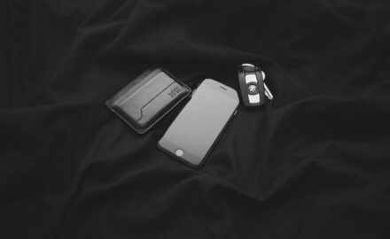 A wallet, mobile phone, and car keys