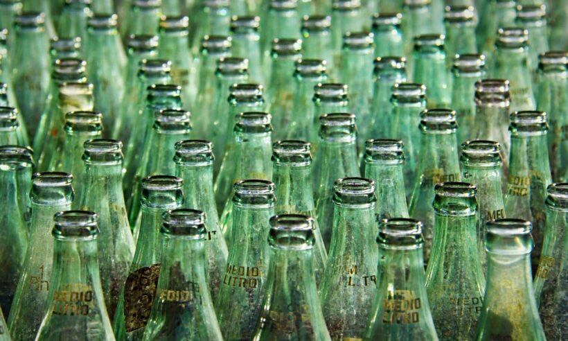 Many empty bottles lined up in rows.