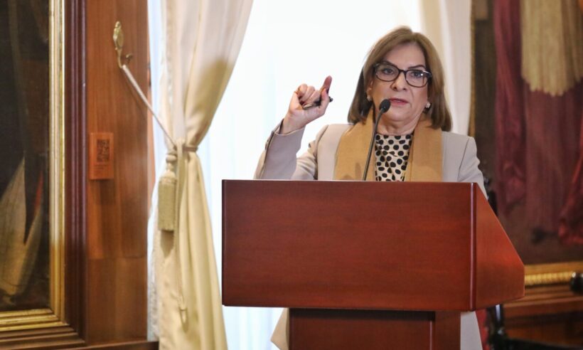 Colombian Inspector General Margarita Cabello speaking in front of a podium.