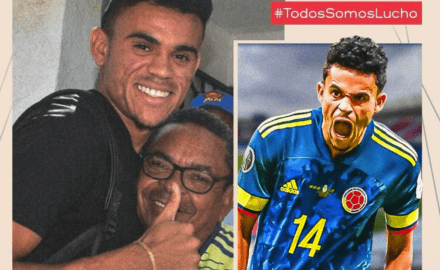 Luis Diaz taking a photo with his father.