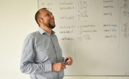Mikhail Krasnov, a Russian-born academic who was elected mayor of Tunja, Colombia, in front of a classroom whiteboard.