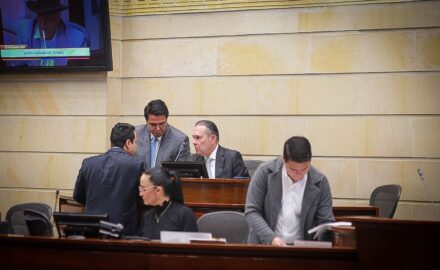 Senate President Efrain Cepeda, centre chair, discuss a bill with congressman in the chamber