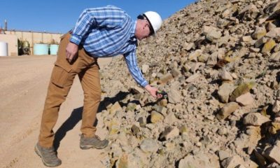 Col. John P. Kunstbeck scans uranium ore for alpha and beta radiation signatures outside of a uranium mill. Kunstbeck is the chief of staff for the 20th Chemical, Biological, Radiological, Nuclear, Explosives (CBRNE) Command and the senior Nuclear and Countering Weapons of Mass Destruction officer for the command. During Operation Pay Dirt, the Aberdeen Proving Ground, Maryland-based Nuclear Disablement Team 1 trained at the White Mesa uranium mill in Utah and the Nichols Ranch in-situ recovery mine and plant north of Casper, Wyoming, April 4 - 8. (Photo Credit: U.S. Army photo by Maj. Mark S. Quint)