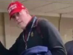 Deportee wearing dunce cap