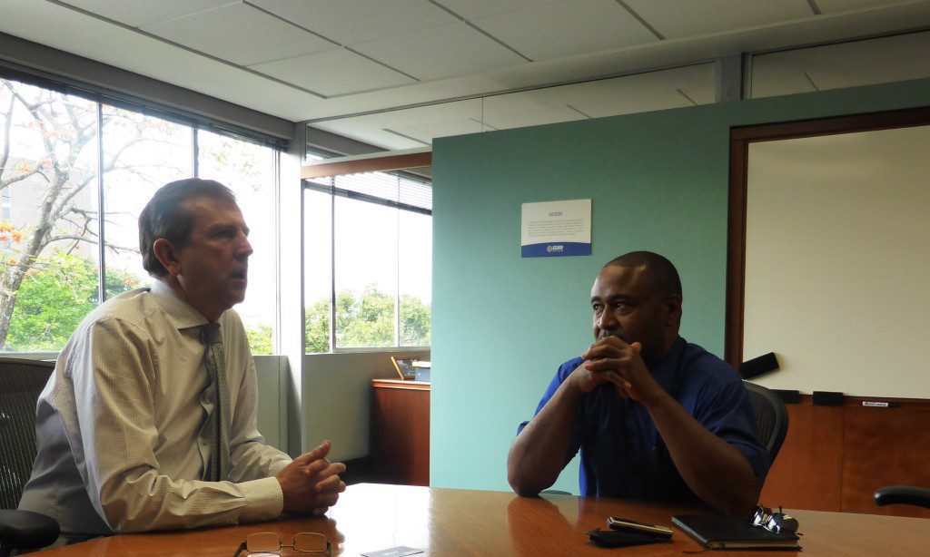 EAFIT's Rector, Dr.  Juan Luis Mejia Arango (left) explains the university's vision to Finance Colombia's Loren Moss