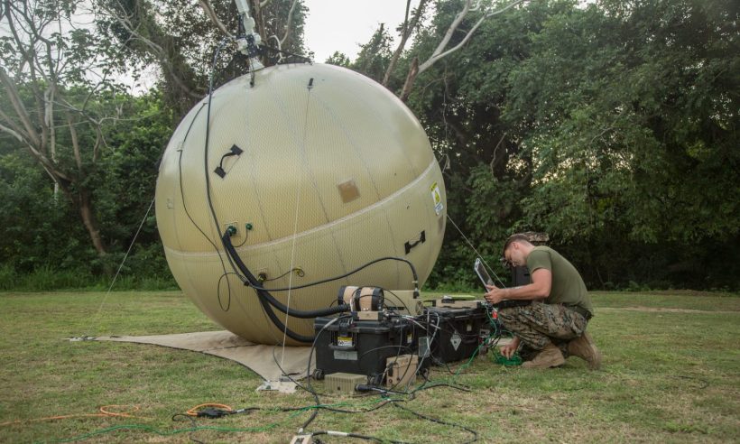 U.S. Marine Cpl. Johnathon Nettles, a data systems administrator with Special Purpose Marine Air-Ground Task Force – Southern Command, finalizes adjustments on a ground antenna transmit and receive (GATR) communications system during the setup of a command operations center in Base de Entrenamiento de Infanteria de Marina, Coveñas, Colombia, Sept. 28, 2019. A GATR is used to establish local area network-based services through a satellite. The task force is conducting training and engineering projects hand-in-hand with partner nation military members in Latin America and the Caribbean during their deployment to the region, which coincides with hurricane season. Nettles is a native of Annapolis, Maryland. (U.S. Marine Corps photo by Sgt. Stanley Moy)