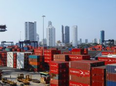 Aerial view of Cartagena port and skyline showing shipping infrastructure and coastal urban development in Colombia.
