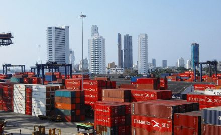 Aerial view of Cartagena port and skyline showing shipping infrastructure and coastal urban development in Colombia.