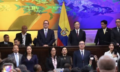 Colombia's 2026 - 2030 Congress is sworn in. Outgoing President Gustavo Petro stands to the right of the Colombian flag, while outgoing Senate President Senator Lidio García stands to its left. Photo courtesy of the Senate of the Republic of Colombia.