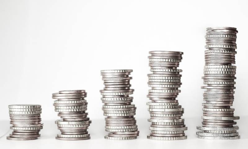 Coins stacked up together to look like a graph. The Financial Superintendency of Colombia estimated that 66% of monetary interactions came from mobile applications. Stock photo by Kevin Schneider via Pixabay.