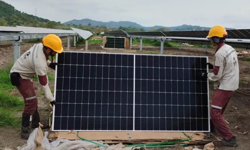 Technicians install solar panels at EPM's Tepuy facility in Colombia (photo courtesy EPM)