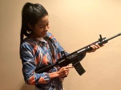 beautiful woman with rifle
