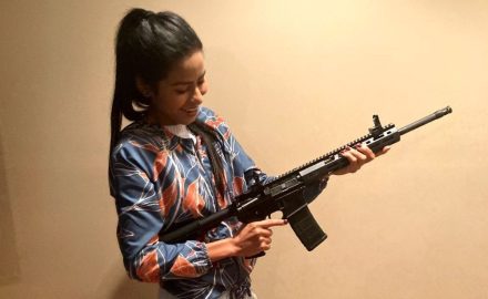 beautiful woman with rifle