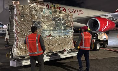 Avianca Cargo ground crew loading relief supplies onto a cargo plane