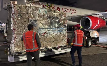 Avianca Cargo ground crew loading relief supplies onto a cargo plane