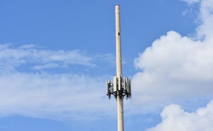 Telecommunications cell tower against a blue sky