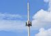 Telecommunications cell tower against a blue sky
