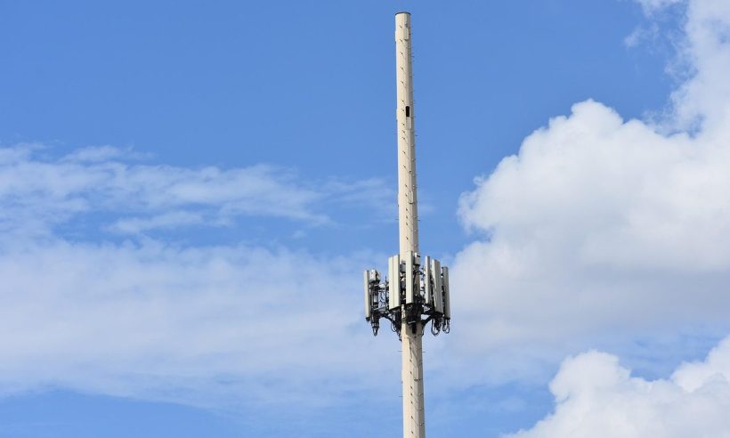 Telecommunications cell tower against a blue sky