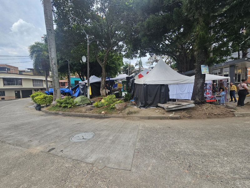 Tents cover a plaza in Pereira's Corosito neighborhood, sheltering residents displaced by the earthquake.
