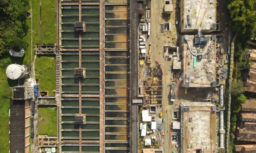 Aerial view of the La Ayura water-treatment plant, with filter basins beside an area under construction