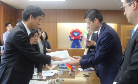 Colombia's trade minister and Japan's state minister of Economy, Trade and Industry shake hands in Tokyo