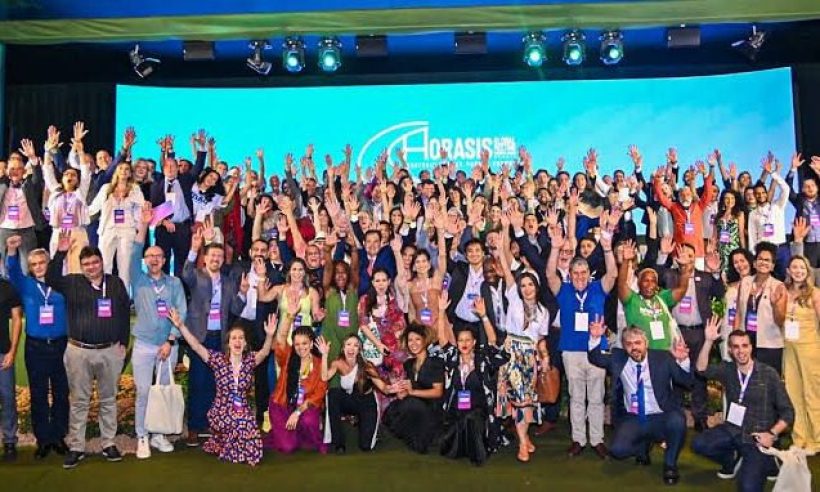 Delegates celebrate on stage at a Horasis Global Summit