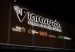 Illuminated Inravision public media system sign on its Bogota headquarters at night