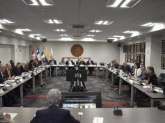 Delegates from Chile, Colombia, Mexico and Peru sit around a conference table at Mexico's Secretaria de Economia.