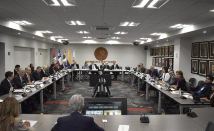 Delegates from Chile, Colombia, Mexico and Peru sit around a conference table at Mexico's Secretaria de Economia.