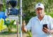 A man with his phone and a 5G pole. Courtesy of Mintic