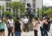 Visitors gather around Fernando Botero's bronze Hombre a caballo in Plaza Botero, Medellín.