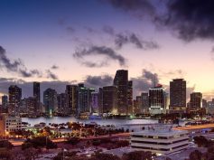 The downtown Miami skyline at dusk across Biscayne Bay